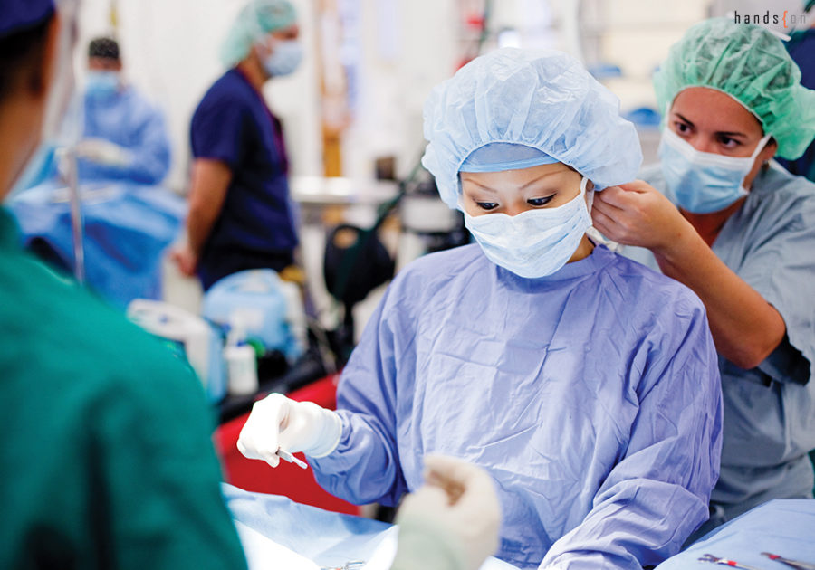 Students preparing for surgery in the operating theatre as part of their clinical training